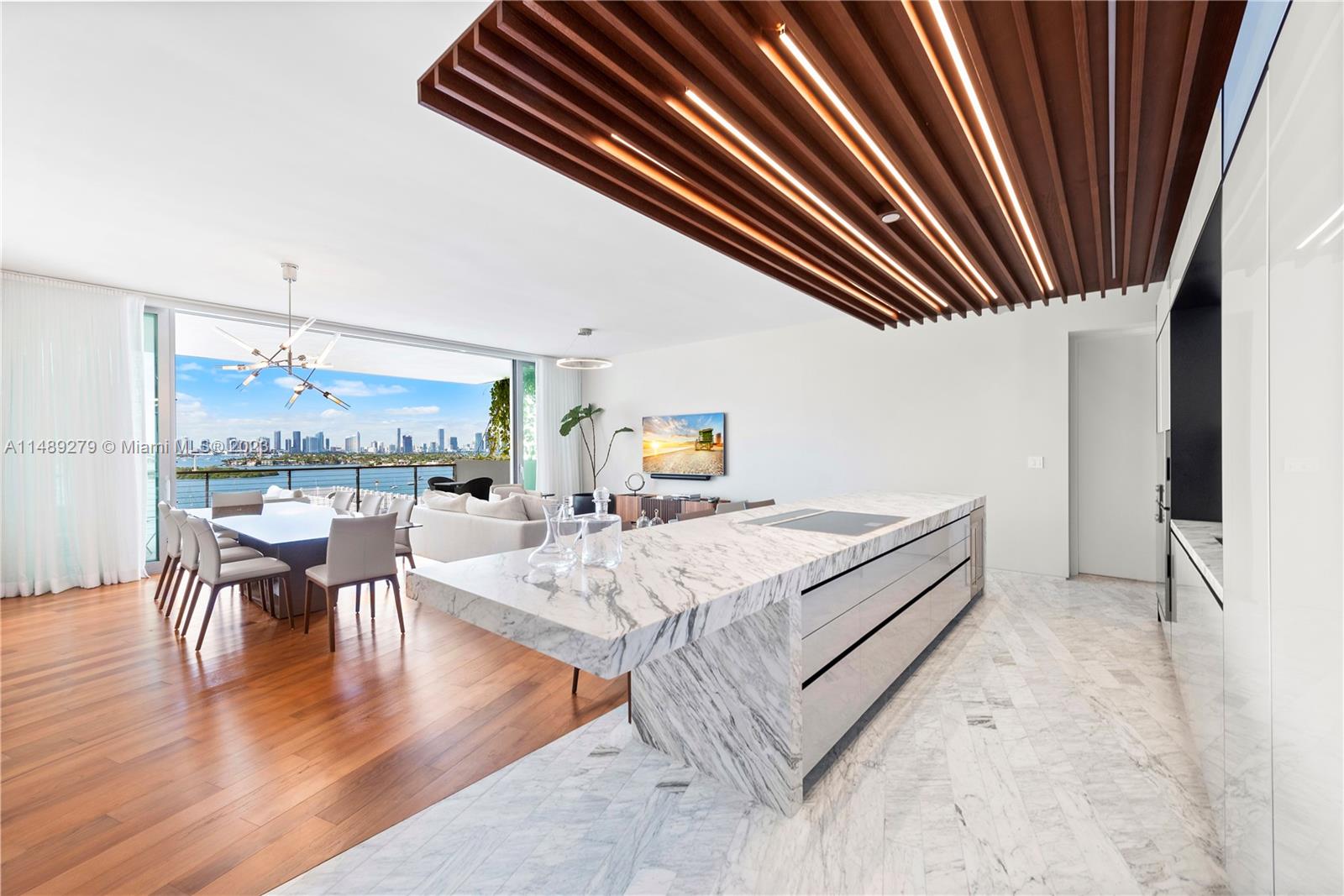 Special and unique floor through unit with Direct Bay/City (west) and Ocean Views (east). Impeccably finished unit in this Pritzker Award-winning Architectural Masterpiece, by “the” Jean Nouvel. 2 bed / 2.5 bath with 1, 910 interior sq feet. Furniture included (Roche Bobois and Artifacto) , designed by well-known designer Ronny Costansi. Full Service building in this boutique (59 units) building with Gym, Breakfast reading room, 24 hr concierge and Valet . Breathtaking views from the pool and quiet bay. 2 Parking Spots. Easy to Show wih 24 hour notice needed.