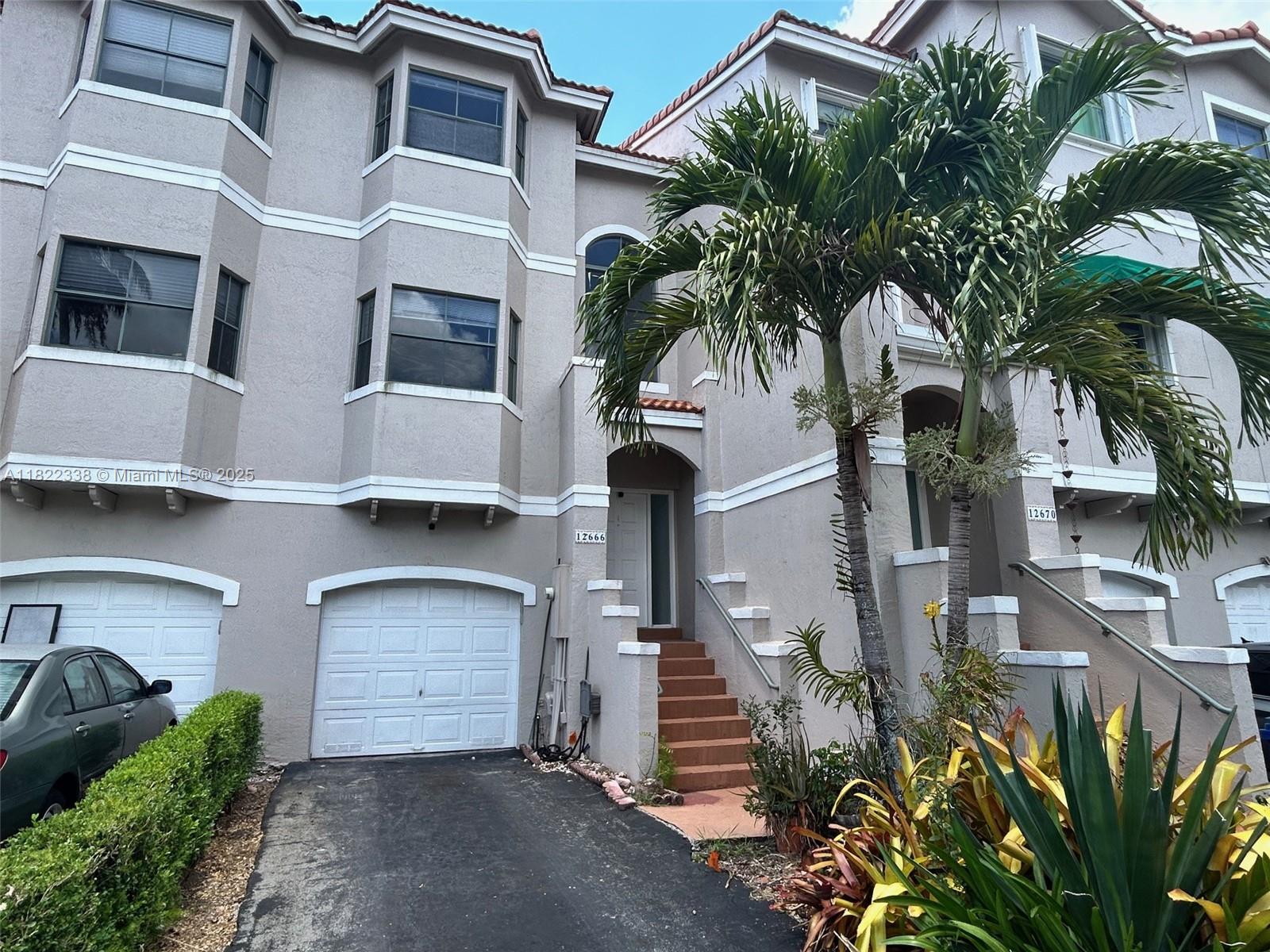 This tri-level property offers three bedrooms and a bathroom on the top floor and one of those bedrooms has a balcony overlooking the pool area. The kitchen, dining, living areas and a guest bathroom are on the middle floor along with a balcony overlooking the pool. The master bedroom is on the first level that opens on to the patio. So when you enter the home from the front door you take the stairs down to your private master sanctuary away from everyone. The flooring is brand new and consistent throughout the three levels. The roof was replaced five years ago with a transferable warranty. If you are looking for a place to call home in beautiful Sunrise with minimal physical maintenance, this is it. Walking distance to shopping, dining and entertainment. Call it home this summer.