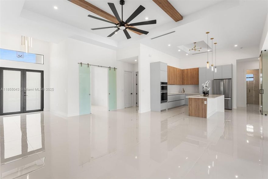 Experience refined living in this modern luxury Cape Coral home near the upcoming Seven Islands Waterfront Community with future marinas, parks, dining & resort amenities! This 2,420 sq ft new construction features a bold exterior, open layout, Spanish porcelain tile, 3 bedrooms + den, 3.5 baths, soaring 16-ft foyer, wood beams, and chef’s kitchen with quartz, custom cabinetry, wine closet & stainless appliances. Primary suite boasts dual walk-ins, spa bath with freestanding tub & rainfall shower. Enjoy a private pool, outdoor kitchen, and 3-car garage. Prime location in SWFL paradise with rising values—an ideal lifestyle and smart investment!