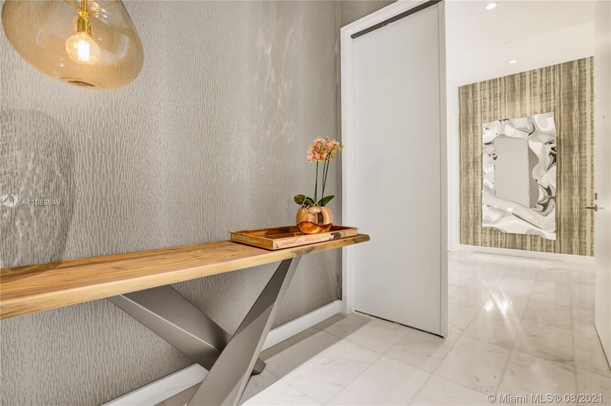 The most coveted line in Park Grove, this corner, high-floor residence boasts formidable bay and city views. Keyed elevator opens to private foyer that leads to a spacious, layout with 12 ft glass walls, separate service entrance, marble flooring, built-in closets, bayfront kitchen with marble counters, Wolf gas range plus Sub-zero and Wolf appliances, pantry and laundry room. A secondary kitchen can be converted to den, media room or entertainment lounge (refer to renderings). A crown jewel designed by Rem Koolhaas with world class amenities including bayfront pool, spa, sauna, wellness lounge with treatment rooms, wine room and more occupying over 5 acres of Enzo Enea grounds. Tenant in place for 6 months paying $26K/month.