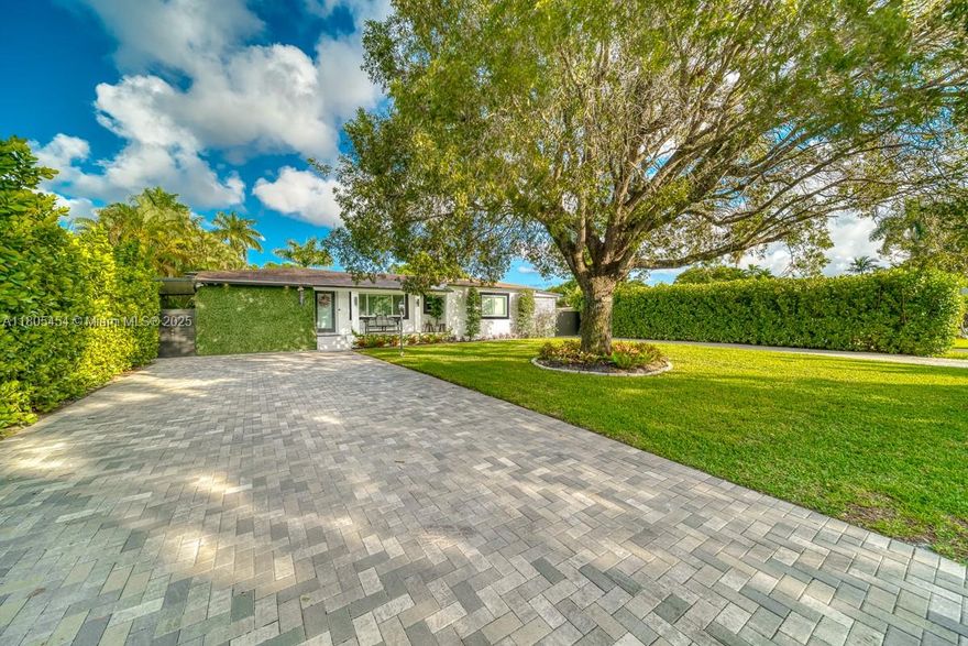 Live the Miami dream in this revamped Biscayne Gardens retreat! On a 14,000-sq-ft lot, the 4 BD/4.5 BA home pairs modern finish with tropical calm. Two complete living areas & kitchens suit multigen living or lucrative Short Term Rental income. Updates: hurricane-impact windows/doors, electric panel, AC & ducts, septic/drain field, remodeled baths, and a stainless chef’s kitchen. Outdoors, enjoy a heated, resurfaced pool with salt system, gazebo, pergola, and huge concrete deck for dining and sun. Driveways parks 10+ cars, with room for boat or RV. Golden Glades Tri-Rail, both airports and Haulover Beach are close. Low taxes, no HOA, & a prime spot between Midtown/Wynwood buzz and Aventura shops, with quick I-95 access. Comfort, income potential, and urban convenience—grab this rare gem!