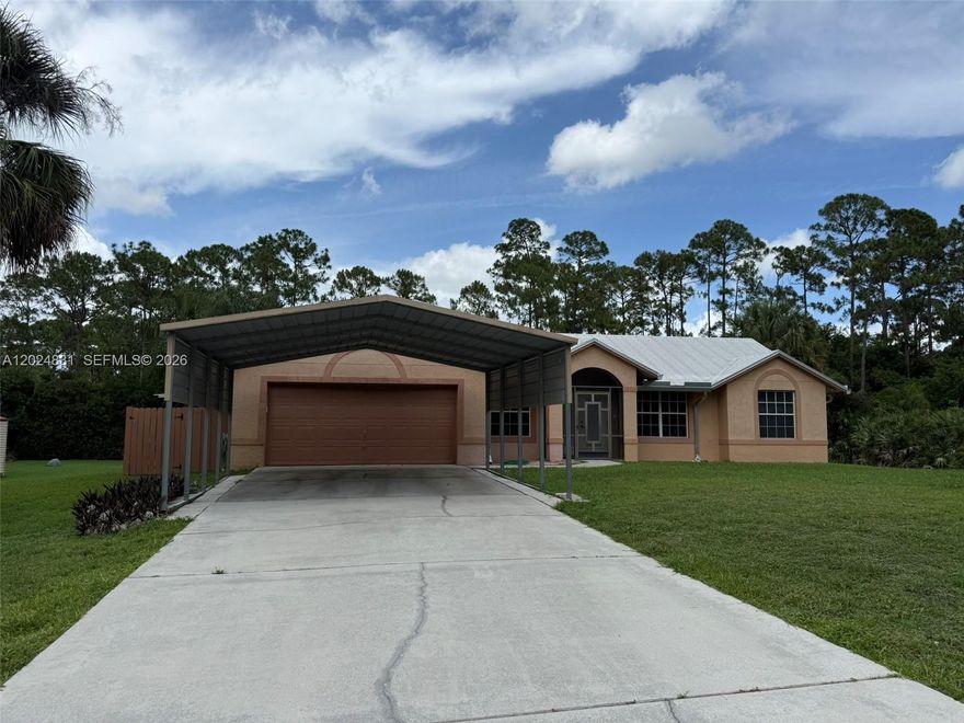 Priced to sell, this lovely 3/2/2 with 1.15 acre lot is ready for you to move in.  Can easily enclose the 600' patio to increase sq. ft. under AC and significantly enlarge the house. 18' tile laid on diagonal, bay windows, hurricane garage doors, garage awning to withstand 150 MPH winds, whole-house water filtration.  
Check out my amazing private wholesale financing with starting rates as low as 3.5% for qualified buyers.  Best payment guaranteed with as little as ZERO down.