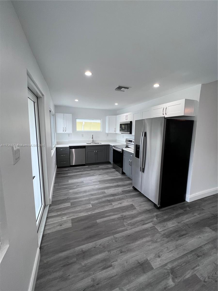 Modern 3-bedroom, 2-bathroom home in the prestigious Rio Vista neighborhood of Fort Lauderdale. This beautifully updated residence features an open-concept layout, abundant natural light, and high-end finishes throughout. The gourmet kitchen boasts stainless steel appliances, quartz countertops, and ample storage. The primary suite offers a private en-suite bath, while two additional bedrooms provide versatility for guests or a home office. Enjoy a well-maintained outdoor space in a prime location just minutes from Las Olas, beaches, marinas, and major highways. Rent includes water, sewer, trash, and property maintenance. Available April 30th—don’t miss this exceptional rental opportunity!