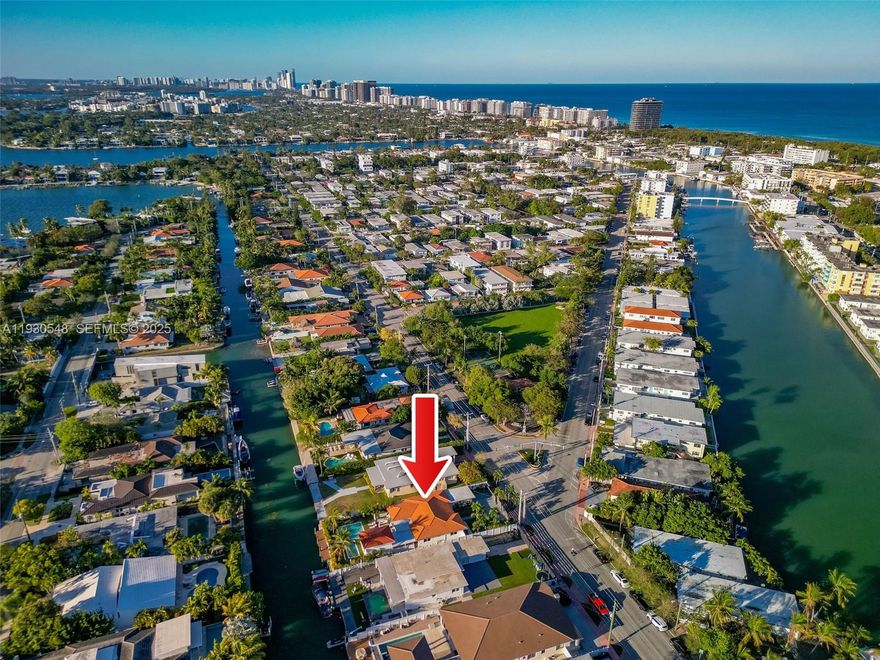 FALL IN LOVE WITH THIS BOATER'S DREAM! NO FIXED BRIDGES! Discover a spectacular upgraded 4-bedroom, 3-bath home offering luxurious living in the Biscayne Point community. Total structure is 2,654sf (house + poolside suite) on a 9,000sf lot. Enjoy 60ft of water frontage, no fixed bridges, and a stunning backyard retreat ready for your waterfront lifestyle. This bright, airy home features spacious rooms, walk-in closet, and impact windows throughout. A newly built poolside suite offers the perfect space for guests or a private office. Step outside to an expansive backyard oasis with a heated saltwater pool (37-ft lap lane), outdoor hot-water shower, kitchen, brand-new seawall, and private dock. Backyard elevation, seawall, and dock built to current regulatory standards.HOUSE SHOWS AMAZING !