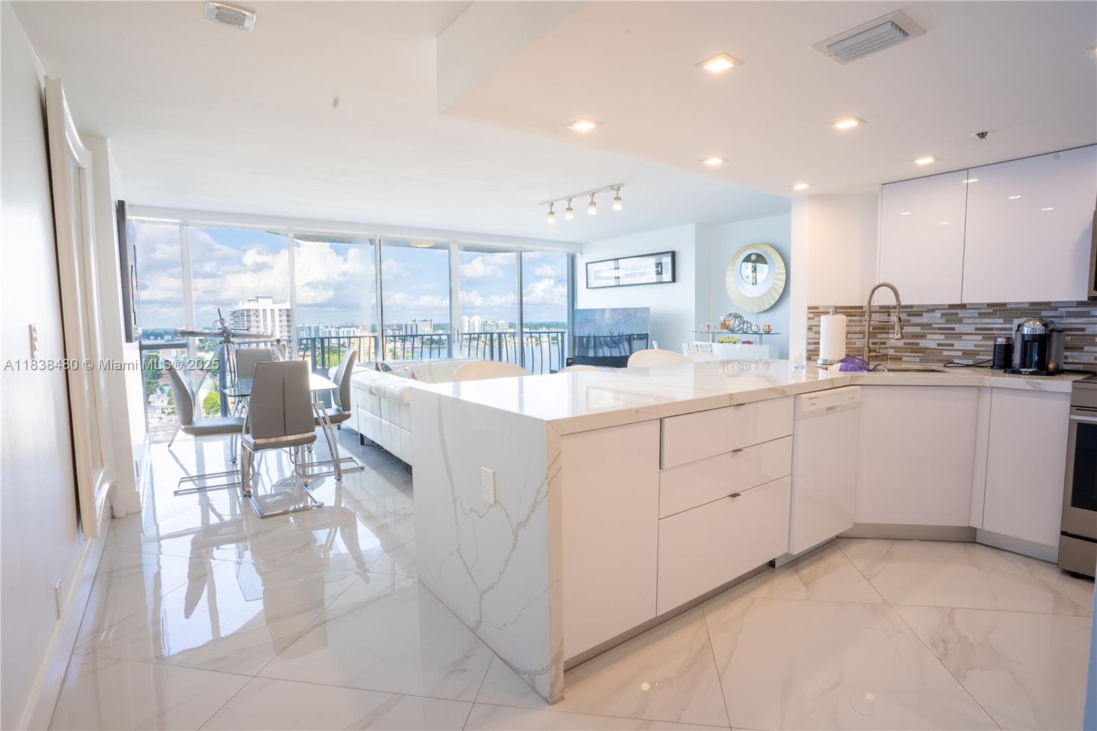This gorgeous 2-bedroom, 2-bath unit on the 21st floor offers breathtaking bay and city views. The modern kitchen features custom cabinetry, sleek quartz countertops, and new appliances. Fresh tile flooring throughout and fully updated bathrooms add to the luxury. Plus, enjoy the convenience of an in-unit washer/dryer and a covered parking space.