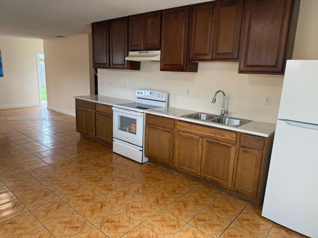 Photo of 911 SW 76th Ave #-, North Lauderdale, FL 33068 (MLS # A11896020)