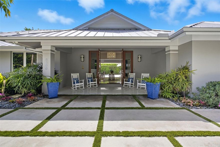 Custom built in 2012 and perfectly located on a quiet, no-through-traffic street, this 4BR/3.5BA North Pinecrest home sits on a 0.37-acre lot. A versatile 5th outdoor air conditioned room is ideal as a home office, gym, or creative space. Features include a 1,200-bottle wine cellar, whole-house generator, CGI impact windows/doors, central vacuum,air-conditioned 2 car garage, security system with cameras, automated gate, insulated roof, underground gas tank, gas stove/water heater, and new dishwasher. The great room opens to a covered terrace & outdoor kitchen with beverage cooler, ice maker, new fans, landscape lighting, mosquito misting, and low-maintenance turf. Just a short walk to Pinecrest Elementary and Wayside Market, this home offers elegance, security, and everyday livability.