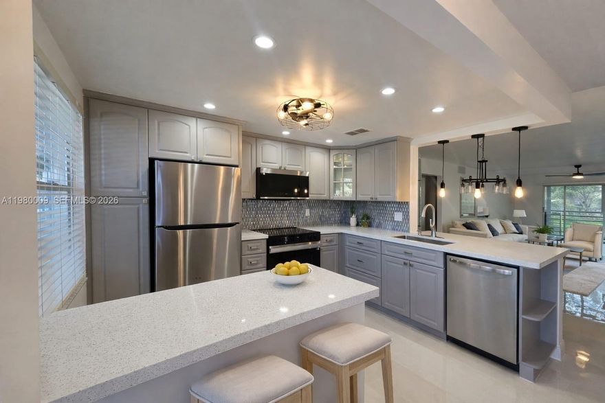 Beautifully renovated 2-bedroom, 2-bath condo located in the desirable Antigua Village within Wynmoor. This spacious 1,156 sq ft second-floor unit features a bright, open layout with tranquil green and golf views, creating a peaceful and private setting. The home has been fully updated with a completely renovated kitchen, new Samsung appliances, modern fully renovated bathrooms with glass shower doors, new flooring throughout, a custom walk-in closet system, popcorn ceiling removed, updated lighting and electrical fixtures, ceiling fans with remote control in every room, and fresh modern paint throughout. The large screened balcony overlooks beautifully landscaped green areas and golf views, offering the perfect space to relax and enjoy Florida sunsets. Situated in a quiet section of the community with convenient access to Wynmoor’s extensive amenities, including golf, clubhouse, fitness center, pools, walking paths, and social activities, this is a perfect move-in-ready opportunity in one of South Florida’s most desirable active adult communities.