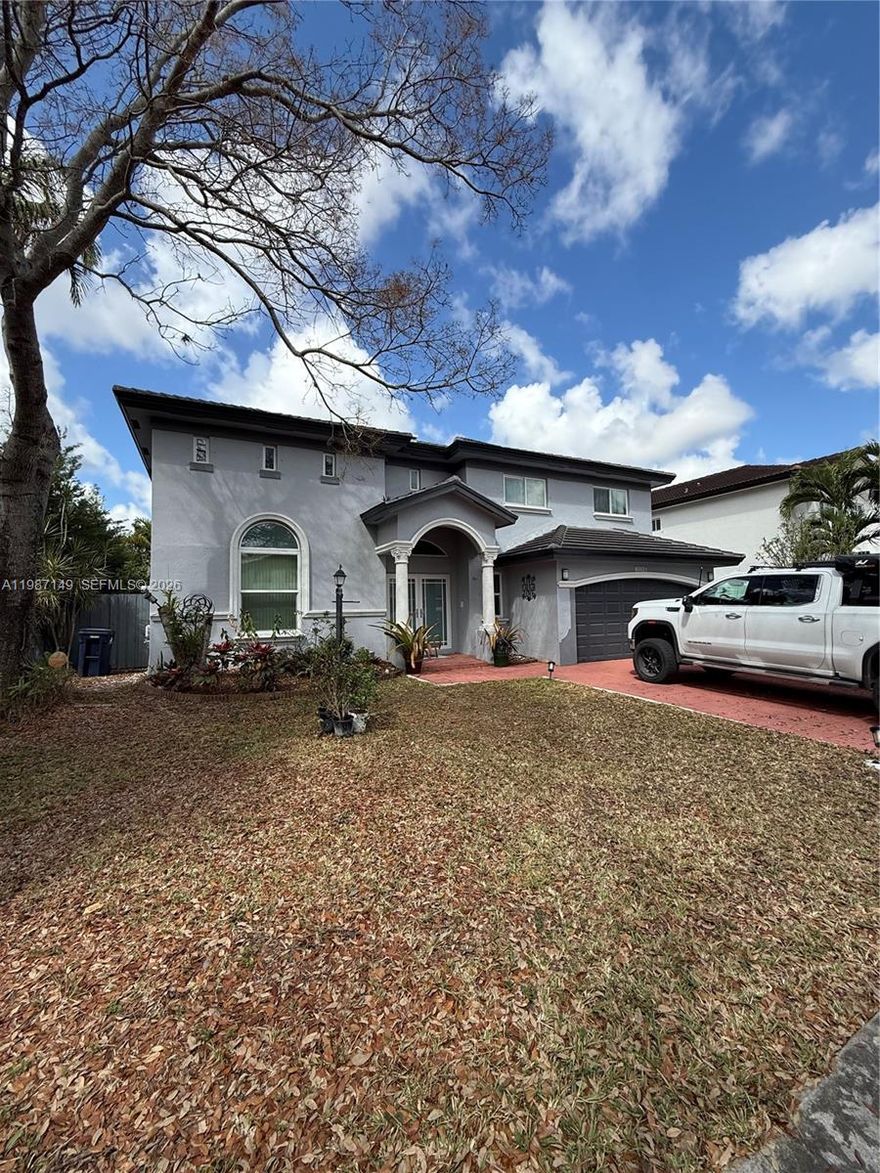 Beautiful 4-bedroom, 3.5-bathroom two-story home located in a quiet and peaceful neighborhood. This spacious residence features soaring high ceilings in the living room, creating a bright and open atmosphere perfect for both everyday living and entertaining. The home is equipped with impact windows and doors, as well as a double car garage with electric garage door opener.

Step outside to a private backyard oasis with a sparkling pool, low-maintenance turf landscaping, and a variety of fruit trees including mango and plantain. Ideal for hosting gatherings or simply enjoying South Florida living at its finest.

This property offers the perfect combination of comfort, functionality, and lifestyle—truly a must-see! Call listing agent for a private showing!