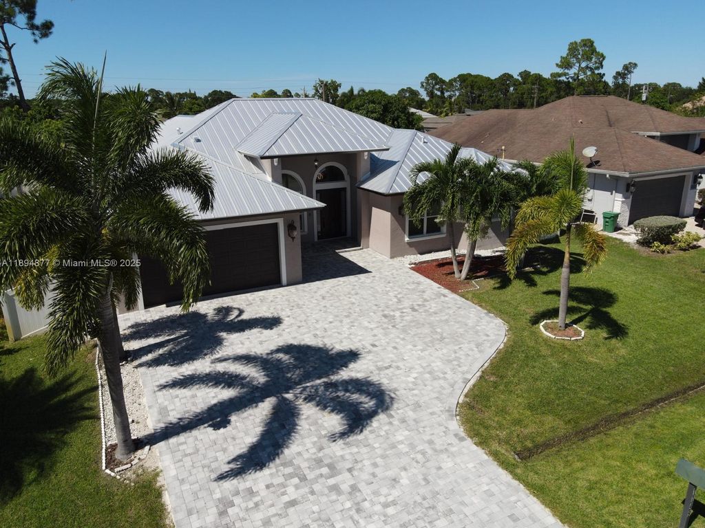 Photo of 1749 SW Desert Ave, Port St Lucie, FL 34953 (MLS # A11894877)