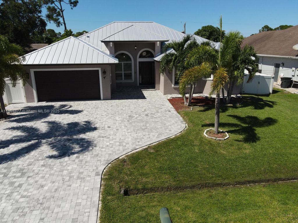 Photo of 1749 SW Desert Ave, Port St Lucie, FL 34953 (MLS # A11894877)