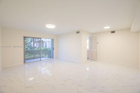 Photo of 11250 SW 13th St #104, Pembroke Pines, FL 33025 (MLS # A11906907)