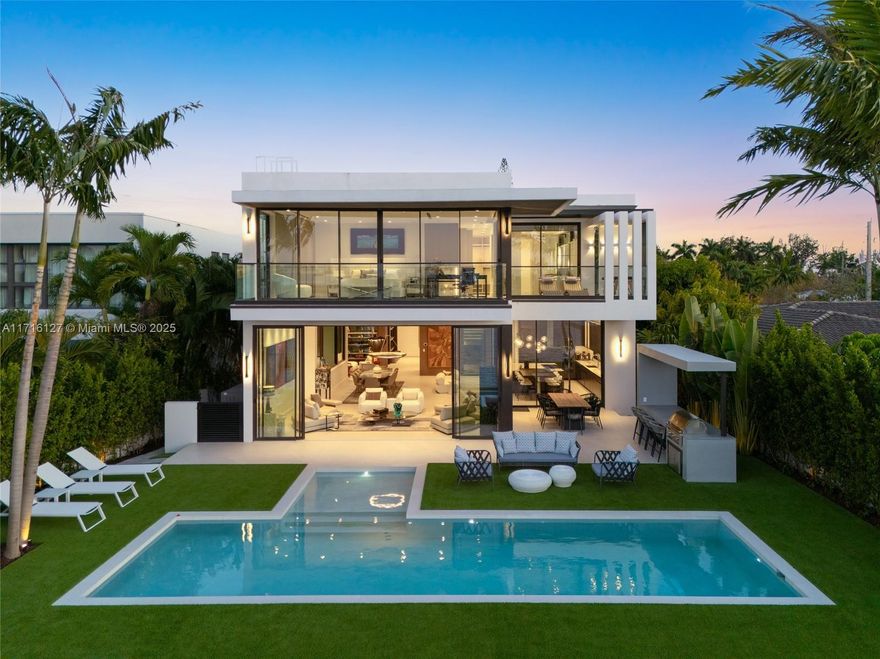 Experience unparalleled luxury with this exquisite, brand-new waterfront villa nestled in the heart of Miami Beach. Spanning over 5,000 sq. ft. of meticulously designed living space, this residence combines contemporary elegance with functionality. The open floor plan and soaring ceilings create an airy ambiance, complemented by a state-of-the-art Scavolini kitchen featuring top-tier appliances and custom millwork. Designed with entertainment in mind, the home boasts a media room, family room, second-floor den, and a generously sized two-car garage. Wraparound balconies invite seamless indoor-outdoor living, offering panoramic views and breathtaking sunsets. 
Located within a gated community, residents enjoy resort-style amenities, including golf, tennis, and a sophisticated clubhouse.