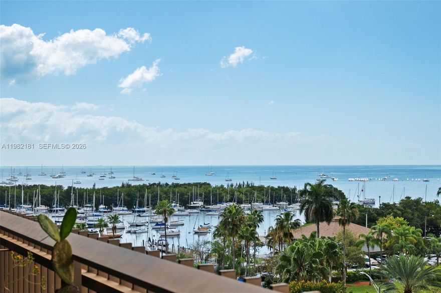 Designed by renowned architect Kenneth Treister, Yacht Harbour is an iconic building in the heart of Coconut Grove. Beautifully remodeled 2-bedroom, 2-bath residence with impact windows, beautiful wood floors throughout, and a spacious private balcony with breathtaking views of Biscayne Bay and the Coconut Grove Sailing Club. Features include in-unit washer and dryer, additional storage, one covered parking space and courtesy valet for guests. Full-service building with 24-hour lobby attendant, complimentary valet, and on-site management for effortless living.Amenities include two lighted tennis courts, heated pool, gym, sauna, outdoor BBQ, and poolside party room.
Enjoy the Grove lifestyle—morning walks along the bay, sunsets from your balcony, sailing just steps away, and easy strolls to sidewalk cafés, restaurants, parks, and the neighborhood movie theater. A perfect blend of waterfront tranquility and vibrant village living in one of Miami’s most beloved neighborhoods.