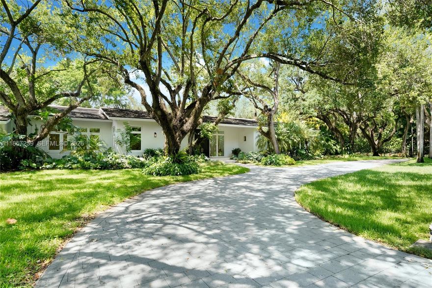 Set on a rare, oversized 56,192 SF lot in one of Coral Gables’ most coveted communities, the prestigious, guard-gated Snapper Creek Lakes offers serene seclusion, lush landscaping, a private marina & naturally elevated terrain. Built in 2021 with meticulous craftsmanship & finishes of the highest caliber. Soaring 12-FT ceilings flood the interiors with light that instantly impresses. Surrounded by greenery, & framed by abundant windows, & expansive gallery-style walls, the functional layout features 6 ensuite bedrooms, 6 full & 2 half baths, chef’s kitchen with dual islands & a private primary wing with office, spa bath, & indoor/outdoor showers. Expansive glass doors lead to a resort-style pool, covered terrace, & space for tennis court, 3-car garage, mudroom, dual laundries & generator.