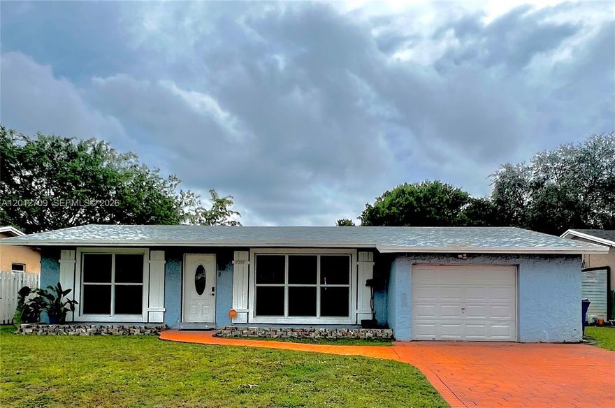 No HOA + major upgrades already done! This well-maintained 2-bedroom, 2-bath home with an oversized 1-car garage features a brand new roof (2024) and impact windows (2024), offering peace of mind and long-term value. Bright and spacious floor plan with tile flooring in the main living areas and laminate in the bedrooms.

The legally enclosed Florida room (310 sq ft) provides flexible space and can easily be used as a 3rd bedroom, home office, or den. Additional features include a smart home system with doorbell camera, alarm, motion sensors, and lighting—all controllable from your phone, plus a water heater (2020).

Enjoy a huge fenced backyard with plenty of room for a pool, a large tool shed, and an in-ground sprinkler system, perfect for outdoor living and entertaining.

Ideally located near University Dr, Florida Turnpike, Fort Lauderdale Airport, beaches, hospitals, and major shopping centers. Move-in ready with big-ticket items already completed—don’t miss this opportunity!