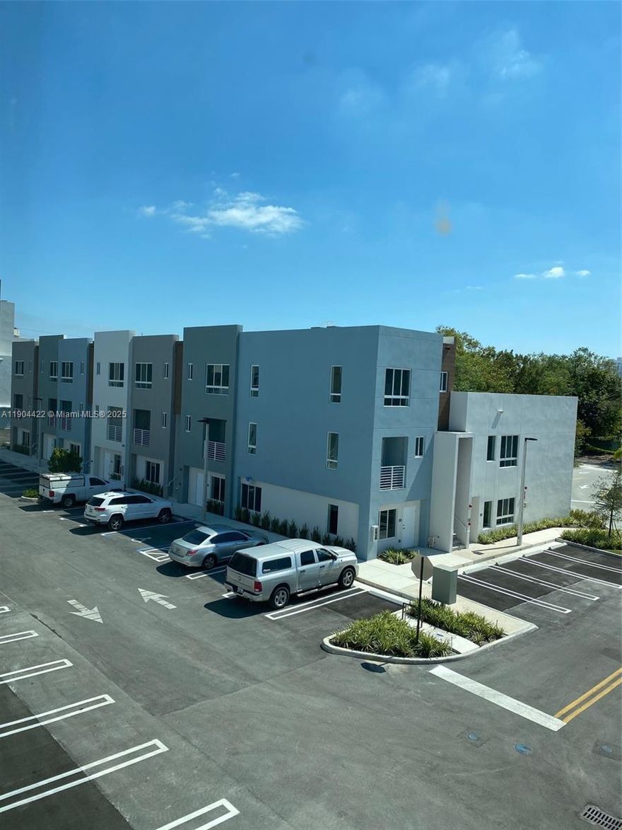 TOWNHOUSE 2 Bedroom 2 Bathroom and a half, with 2 parking spaces !!! GOOD AREA, BEAUTIFUL SPLIT LEVEL CONTEMPORARY STYLE , LOCATED IN A VERY QUIET NEIGHBORHOOD IN AVENTURA, OPEN FLOW KITCHEN WITH A CENTER ISLAND, STAINLESS STEEL APPLIANCES AND SOFT CLOSE CABINETS, SPLIT DINING AND LIVING ARE WITHN BALCONY. WASHER AND DRYER IN UNIT. CUSTOME LIGHT FIXTURE . VIEWS OF THE COMMUNITY POOL!! VACANT IN NOV 7, 2025