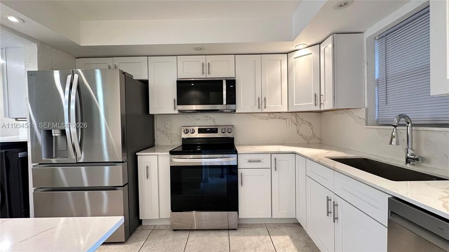 Beautifully remodeled condo located in the desirable Greens of Inverrary, a gated 55+ community. This bright and spacious residence features a 1-bedroom, 1.5-bath split floor plan with an open, inviting layout. The unit includes an in-home washer and dryer for added convenience. Enjoy serene views of lush greenery and the community pool from your private screened-in patio. The updated kitchen showcases attractive cabinetry and newer LG appliances (approximately one year old). Major updates include a 2022 A/C system, a 2024 water heater and impact windows and doors provide comfort and peace of mind. Tile flooring runs throughout the home. The primary bedroom offers generous walk-in closets. Residents enjoy secure, gated entry and access to a community pool. The condo fee covers most insurance, internet, cable, water, and trash services. Conveniently located near shopping, dining, beaches, and the Florida Turnpike, this move-in-ready home offers both comfort and convenience.