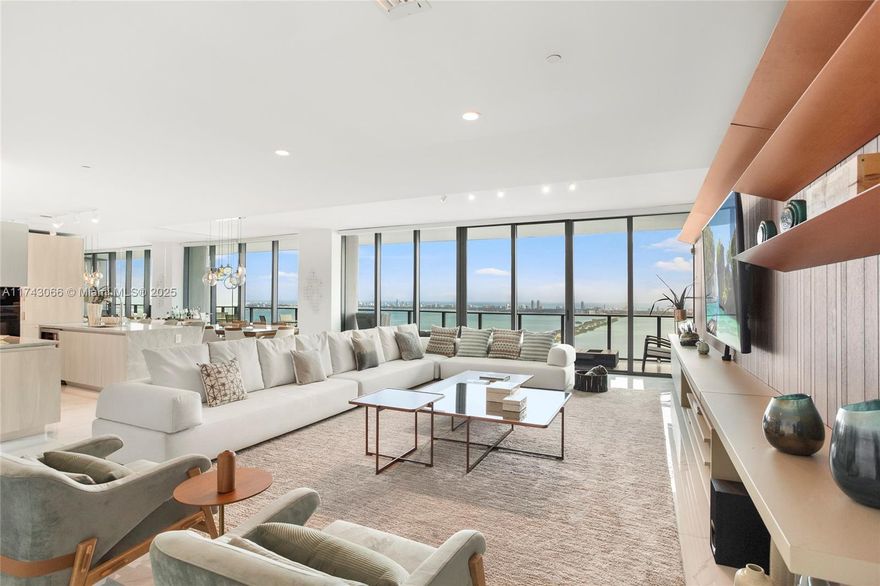 Stunning 4 Bedroom waterfront Lower Penthouse at prestigious ONE PARAISO, designed by Italian Architect Piero Lisoni. Interior decorated by Renowned Brazilian Designer with no expenses spared, very private direct waterfront facing ample views to Miami Beach Skyline, Ocean and Bay will welcome the most amazing Sun and Moon rises over the bay. Professionally finished and equipped with high-end electronics, motorized shades, automated AC and lights with high quality furniture. Maids room (5th bed) and office. Amenities are superb from Tennis courts to multiple pools, private elevators to your unit, movie theater, Spa, Gym, multiple activity rooms, concierge and Spa attended. 2 parking spaces and available Valet. Residents have access to a private boat dock Sold fully Furnished and equipped.