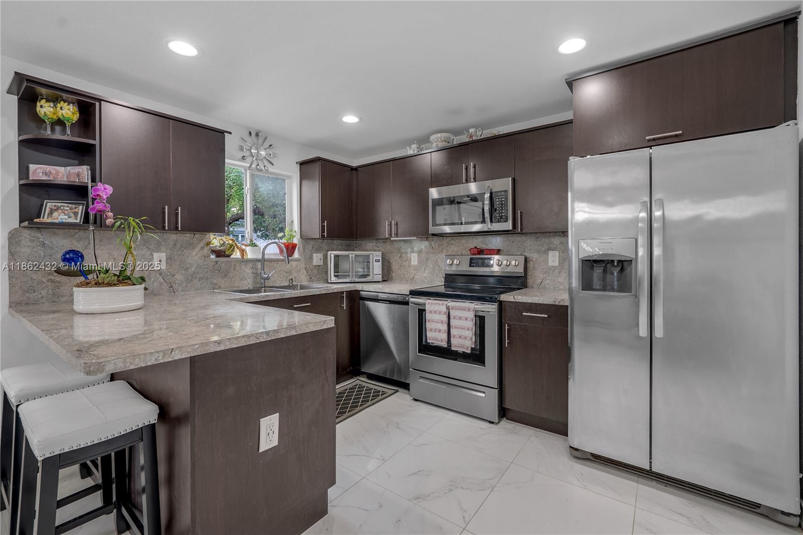 Welcome to 3020 NW 45th St, a versatile home built in 2020 that offers an incredible opportunity for both homeowners and investors. This spacious property can be enjoyed as a full single-family residence or configured to maximize rental income. The layout allows the end buyer to rent the entire home, lease the top and bottom floors separately, or live on the bottom floor while renting or Airbnb-ing the top. With multiple options available, this home provides both comfort and flexibility, making it perfect for those seeking a primary residence with income potential or an addition to an investment portfolio. Its unique setup creates opportunities for long-term tenants, short-term rentals, or multi-generational living, all while being located in a convenient and desirable neighborhood.