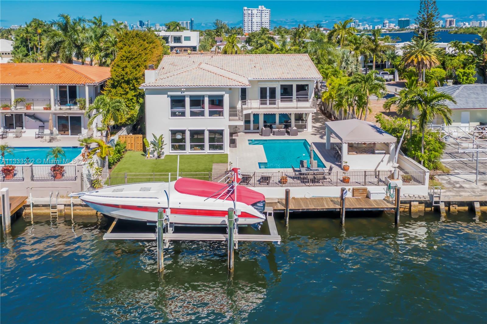 "DEAL FELL THRU BACK ON MARKET" "POINT LOT" "BAYVIEWS" LOWEST PRICE PER SQ FT IN DADE COUNTY,"OWNER W/FINANCE" @"6%"!, SECLUDED GAURD GATED COMMUNITY in "THE ESTATES OF SANS SOUCI". A RARE FIND ONLY 1 LOT OFF THE "WIDEBAY".75' OF DEEPWATER DOCKAGE 24000lb. BOATLIFT *DIRECT OCEAN ACCESS* Views to Miami Beach and Downtown Skyline, Custom home new built in 2003,Walk into 24'High Ceiling entry looking straight to the water.Priced well for location with over 6100 gross sq.ft.Huge Open Double Island Eat-in kitchen with SS Viking appliances.Very large bedrooms 3 w/Bayview's all baths are marble to ceiling,Master Suite has 15 Foot Vaulted Ceilings,spacious master bth w/Jacuzzi,toilet,bidet, Custom outdoor kitchen.18K Gas Generator, private electronic gate entry, Easy to See, Broker 2 blocks away.