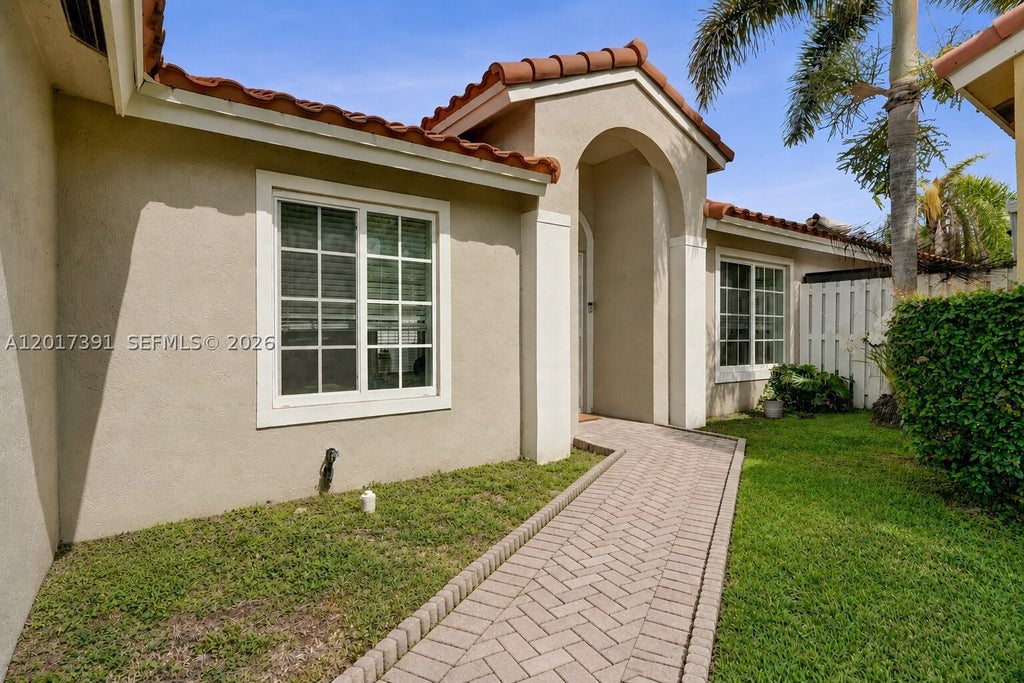 Photo of 1212 NW 125th Ter, Sunrise, FL 33323 (MLS # A12017391)