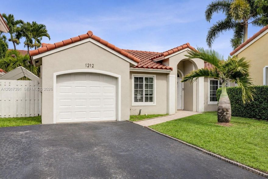 Beautifully updated lakefront home in the desirable Sunset Bay at Residences of Sawgrass, offering a comfortable blend of indoor and outdoor living. The oversized backyard and large covered tile patio create a great setting for relaxing by the water, entertaining guests, grilling, or simply enjoying the peaceful lake views year-round. Inside, the home feels clean, bright, and well cared for with spacious living areas, smooth ceilings, crown molding throughout, recessed lighting, and modern finishes that give the home a warm yet updated feel. The kitchen serves as a central gathering space and features shaker cabinetry, quartz countertops, newer appliances, modern lighting, and an open flow into the main living areas that works well for both everyday living and entertaining. The garage has been converted into an exercise room, creating a flexible space that can easily function as a home office, playroom, hobby room, or be converted back into a garage if desired. Major improvements already completed include hurricane impact windows and doors, updated electrical service to help meet current insurance requirements, a sprinkler system, and a newer roof. Conveniently located near major highways, shopping, dining, parks, and everyday conveniences while still offering the privacy and atmosphere of a waterfront home.