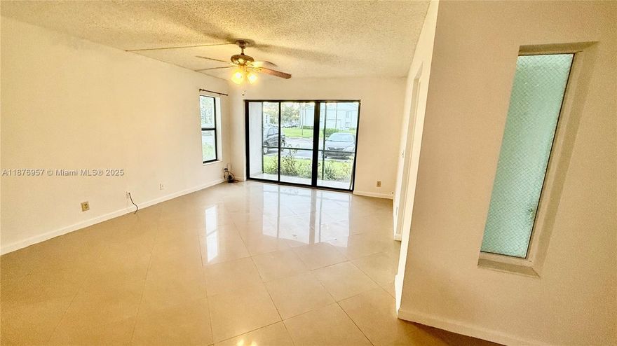 Charming first floor condo with screened patio. Tile throughout in this spacious 2 bedrooms, 2 baths and an additional room with closet perfect for a home office or 3rd bedroom.
