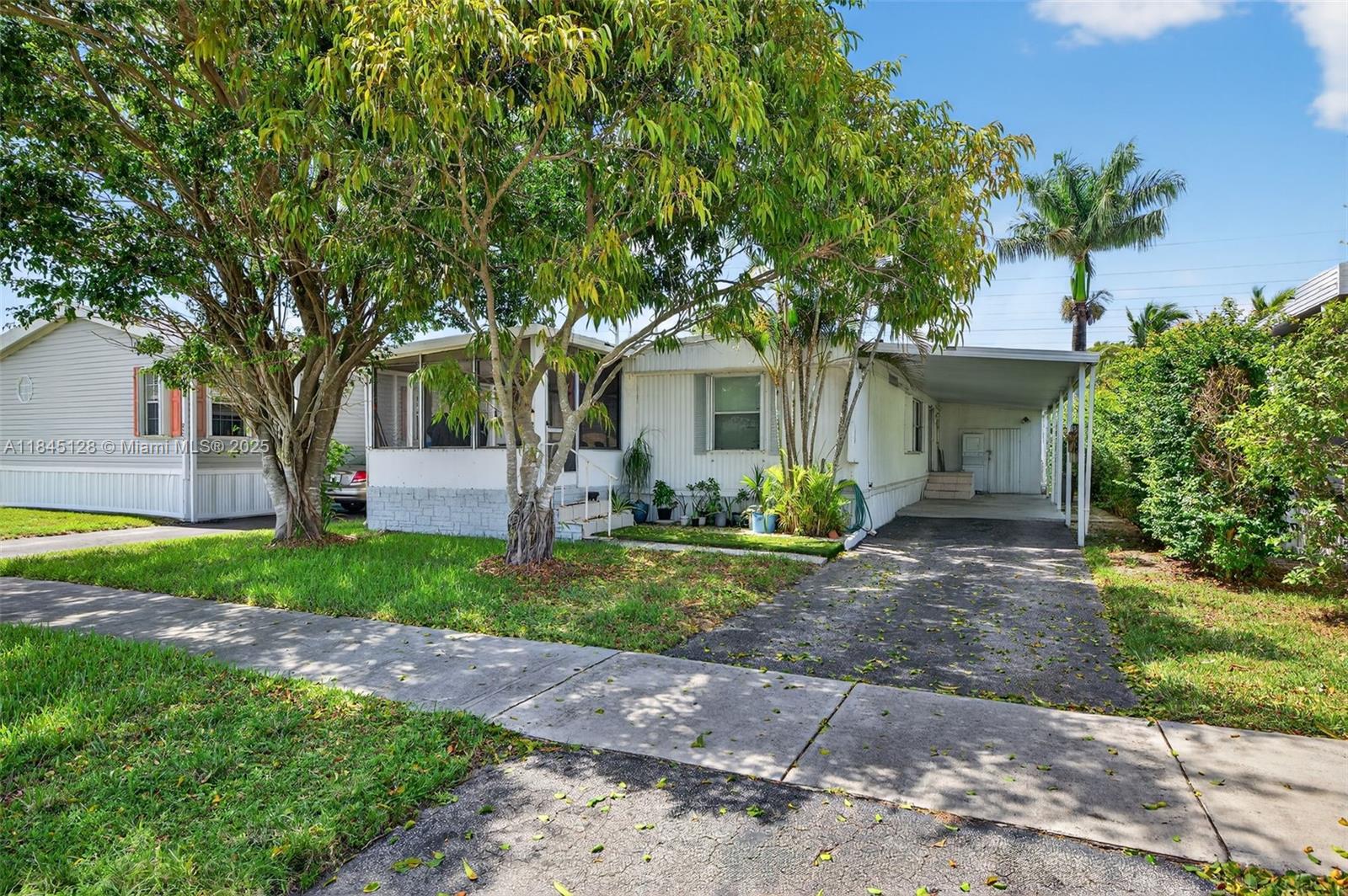 ONE OF THE BEST LOTS IN ALL OF RAVENSWOOD! ONE OF A FEW PROPERTIES HERE WERE YOU HAVE A NICE BACK LAWN AREA FOR MORE ENJOYMENT. YOU OWN THE LAND HERE AS WELL. THIS IS ONE OF THE NICEST, MOST ESTABLISHED MOBILE HOME PARKS IN ALL OF SOUTH FLORIDA. THIS CAN BE A GREAT PRIMARY RESIDENCE, SEASONAL RESIDENCE, VACATION HOME OR INVESTMENT. THE PROPERTY RIGHT NOW IS TENANT OCCUPIED AT $2000.00 PER MONTH ON LEASE THRU THE END OF AUGUST. TENANTS WILLING TO STAY IF YOU WANT THE INVESTMENT INCOME OR CAN VACATE THEN IF YOU NEED TO OCCUPY. PROPERTY WAS RECENTLY UPDATED WITH NEW FLOORING AND MORE AS OF 2024. THE HOME IS IN GREAT OVERALL CONDITION & THE MOBILE HOME PARK ITS SELF IS IN FANTASTIC SHAPE TOO. THE PARK OFFERS PLENTY OF AMENITIES TO KEEP YOU BUSY AND HAVING FUN. HOA FEE IS ONLY $70 / MONTH.