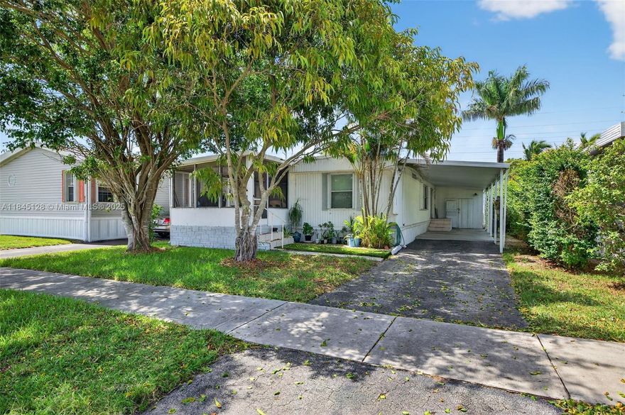 ONE OF THE BEST LOTS IN ALL OF RAVENSWOOD! ONE OF A FEW PROPERTIES HERE WERE YOU HAVE A NICE BACK LAWN AREA FOR MORE ENJOYMENT.  YOU OWN THE LAND HERE AS WELL. THIS IS ONE OF THE NICEST, MOST ESTABLISHED MOBILE HOME PARKS IN ALL OF SOUTH FLORIDA. THIS CAN BE A GREAT PRIMARY RESIDENCE, SEASONAL RESIDENCE, VACATION HOME OR INVESTMENT. THE PROPERTY RIGHT NOW IS TENANT OCCUPIED AT $2000.00 PER MONTH ON LEASE THRU THE END OF AUGUST. TENANTS WILLING TO STAY IF YOU WANT THE INVESTMENT INCOME OR CAN VACATE THEN IF YOU NEED TO OCCUPY. PROPERTY WAS RECENTLY UPDATED WITH NEW FLOORING AND MORE AS OF 2024. THE HOME IS IN GREAT OVERALL CONDITION & THE MOBILE HOME PARK ITS SELF IS IN FANTASTIC SHAPE TOO. THE PARK OFFERS PLENTY OF AMENITIES TO KEEP YOU BUSY AND HAVING FUN. HOA FEE IS ONLY $70 / MONTH.