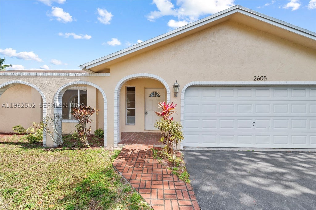 Photo of 2605 NW 98th Ln, Coral Springs, FL 33065 (MLS # A11962502)
