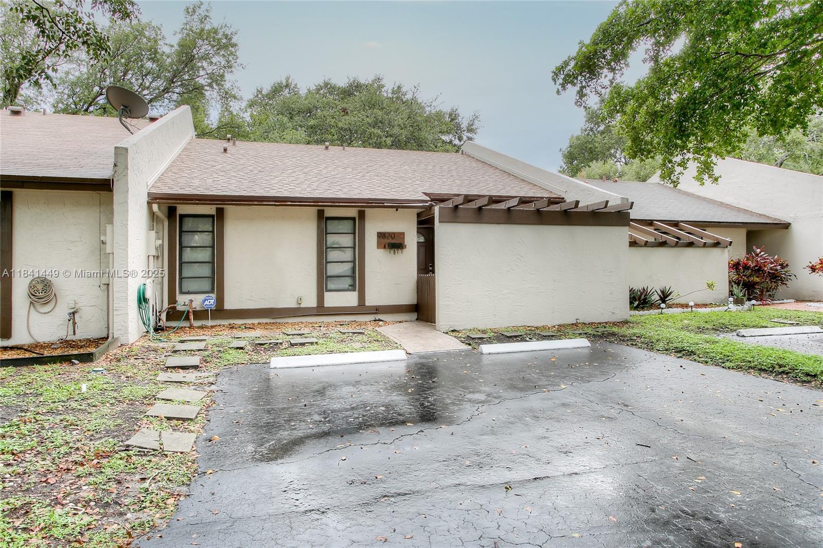 A full video of the property is available upon request. Nicely remodeled 2-bedroom, 2-bathroom townhome in the highly desirable East Lakes community of Pembroke Pines. Step inside to find modern wood-look tile flooring and LED recessed lighting throughout. The kitchen and bathrooms have been elegantly updated, featuring a sleek wine fridge. The spacious, fenced-in yard is perfect for family gatherings, complete with hookups for a TV and sound system. Enjoy peace of mind with recently updated A/C and electrical panel, along with a brand-new roof. Low HOA fee you’ll have access to amenities like a pool, playground, tennis court, and more. The property includes two assigned parking spaces and ample guest parking.