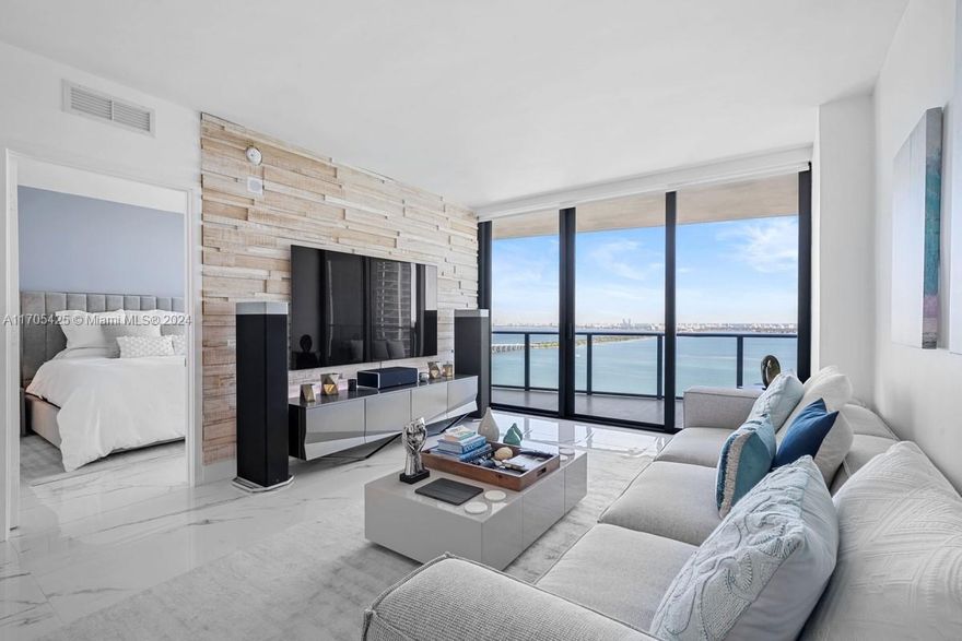 This stunning 2-bedroom condo at Icon Bay offers breathtaking, unobstructed bay views & has been thoughtfully upgraded w/ modern, high-end features. All-new kitchen w/ elegant quartz countertops & marble backsplash. Top-of-the-line GE Monogram appliances, including an induction cooktop for precision cooking. Smart Home Features: Wi-Fi-controllable LED lighting throughout the unit. iOtty smart light switches for seamless automation. All-new Wi-Fi-controlled blinds, including blackout options for added privacy & comfort. Ecobee smart thermostat for efficient climate control. Bathrooms upgraded w/ new countertops, sinks, & faucets. LED mirrors for a sleek & modern look. Tempered glass closet doors, adding a sophisticated touch. Much more.. Extra sound proofing added to each exterior wall.