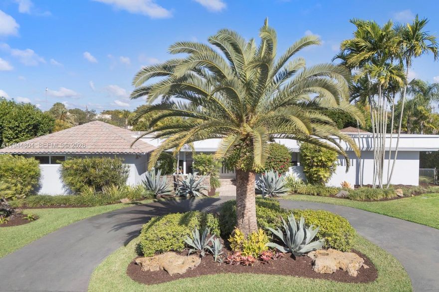 Beautiful, large, and loved family home located on a wonderful corner lot on a quiet street in the heart of The Falls/East Kendall.  Fantastic open split-plan layout with recently updated primary bathroom, huge early 2000s kitchen w/wood cabinets and tons of storage, and very large living spaces and bedrooms.  Ideal house for entertaining.  Brand new 2025 septic tank and drainfield, impact glass windows and doors throughout, indoor laundry room, wet bar off the family room and more.  Large covered patio terrace leading to lush and private pool and backyard with plenty of play area.  Great schools and central location to all.