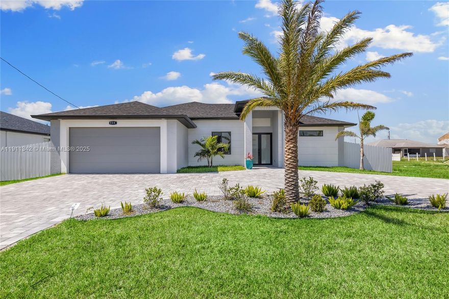 Stunning 3BR+DEN/3BA pool home in Cape Coral, built in 2022, showcasing a modern open-concept ranch design with high-end finishes throughout. Enjoy quartz countertops, stainless steel appliances, an outdoor kitchen, and a split-bedroom floor plan. The spa-like primary suite offers dual sinks, a walk-in shower, and spacious closets. Additional highlights include a fenced backyard, two-car garage, high-impact windows/doors, and beautiful landscaping—all just minutes from shops, dining, and beaches. Don't miss the opportunity to call it Home!