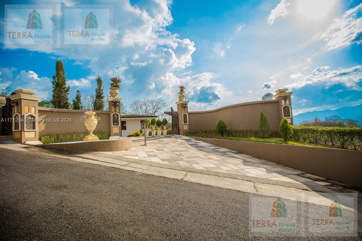 The Opportunity of this Beautiful House w a downing price of $6,75 M to the half of $ 3.2 M includes Furniture, Art Paints, was builted for a famous Arquitecto has 2 big suites as a masters rooms w a balcony private and spectacular windows w a great and paramount views to the Mountais landscape this Awesome mansion only will be for sale for short in the market w this price.We accept bitcoins or dollars in USA if you need a loan the owner can do directly only receiving 50% of down payment.This is a true lifestyle property Atenas is located just 30 mins from San Jose Inter Airport.2200 M2 Sq foot construction 1.8 hits of land, The entire property was designed for entertaining,there are several outdoor lounge areas,each with its own kitchen and stunning views. The infinity edge pool