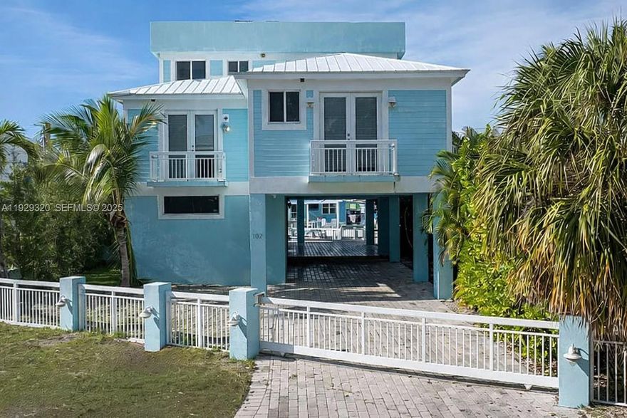 Three level, 4 bed/ 4 bath home has a private third-floor master suite with a large den and balcony. The great room, bathed in natural light, offers stunning bay views, and the expansive rooftop deck is perfect for enjoying splendid sunset vistas. The ground level is an entertainer's dream, featuring a large media room, inside laundry, kitchenette/wet bar, full bathroom, and a fourth bedroom or den that opens directly onto the pool deck. Outside, enjoy the pool with a paver deck and covered patio, or relax on the concrete dock with direct bay access and convenient ocean access via Tavernier Creek. Custom features such as tongue and groove ceilings throughout the great room, built-in closets, nd tall doors that open to porches on every level, enhancing the home's character and appeal. This is a wonderful opportunity to personalize a spacious waterfront residence to suit your style.