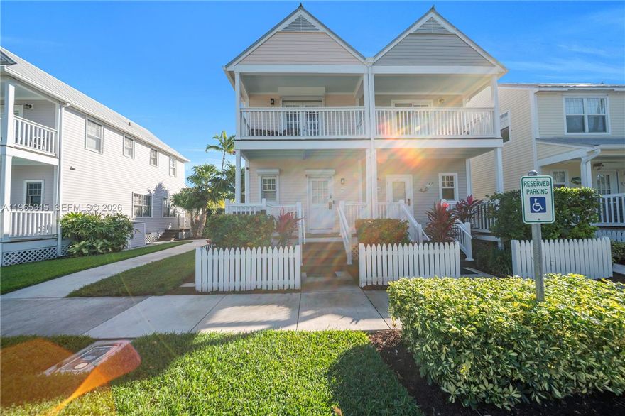 Recently updated throughout, featuring a completely renovated spa/jacuzzi installation, brand new tile flooring throughout the entire unit, and freshly painted interior and exterior walls. Plantation shutters enhance the interior, while updated interior doors and modern hardware add a refined touch. The open layout offers tile flooring on the main level and wood laminate upstairs. The spa pool has been refinished and retiled, complemented by elegant tile accents along the surrounding privacy wall. Enjoy the private patio with landscape lighting, outdoor shower, and roll-down/accordion shutters for added protection. The kitchen features white cabinetry, a stylish backsplash, stainless steel appliances, and granite countertops. A motorized shade with a remote control along the sliding doors provides privacy and shade. Conveniently located next to the Fishing and Walking Pier access. Offered fully furnished with a few exclusions. Owners may enjoy the amenities of Hawk's Cay Resort with participation in the resort management program.