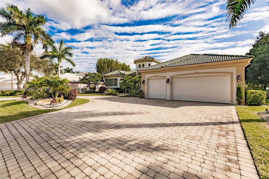 Located in the prestigious and sought after guard gated community of Stonebrook Estates. This beautifully maintained Waterford model has been kept in pristine condition and sits on a half-acre premium lot with serene wide water views.  Features 5 bedrooms, 5.5 baths plus an office. Highly desirable triple split floor plan with volume ceilings and marble floors in main living areas. Expansive primary suite with large dual walk-in closets. Gourmet kitchen featuring solid wood cabinetry. All large secondary bedrooms with ensuite bathrooms.  Resort style backyard ideal for entertaining with heated pool/spa and nice landscaping. Stonebrook amenities include clubhouse with fitness center, media room, party room, playground, tennis, pickleball, basketball, and volleyball courts.