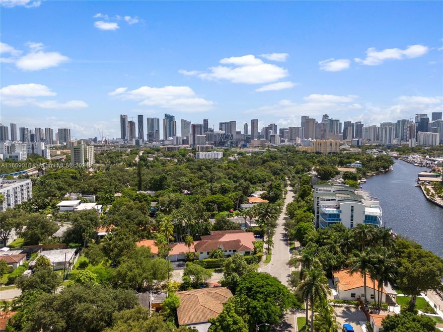 Rarely available home in Miami River's historic Spring Garden community. The home features an open layout, perfect for entertainment. With its 15-foot ceilings and exposed beams, the chef's kitchen creates a modern industrial vibe, while honed marble floors add elegance to the seamless layout. Enjoy alfresco dining on the covered terrace overlooking the sparkling pool. Additional highlights include a gym and a private guesthouse with its own bedroom, bathroom, kitchen, and entrance. Perfect for daily living and stylish entertaining, indoors or outdoors, this home is ideally situated on the Miami River in the charming Spring Garden neighborhood.