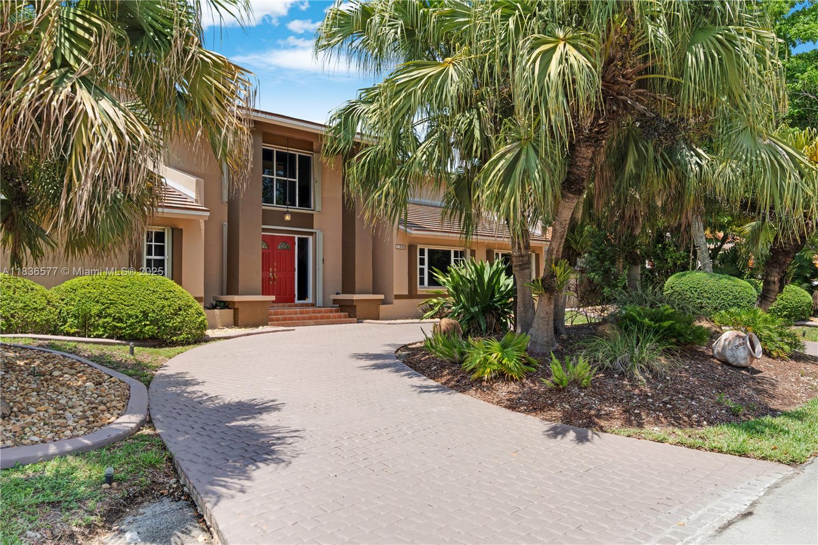 Located in a cul-de-sac, this spacious 5BD/3.5BA home offers the perfect blend of comfort and versatility. A welcoming foyer leads to formal living and dining areas, a generous family room, and a well-appointed kitchen with a built-in workstation and cozy breakfast nook. The upstairs primary suite impresses with a private balcony, large en-suite bath, and walk-in closet. Two downstairs bedrooms share a bath and feature a separate entrance, ideal for extended family or guests. Relax or entertain on the private patio with a pool. Features include a newer roof, PVC plumbing, two A/C units, and accordion shutters. Conveniently located near shopping, dining, and the highways.