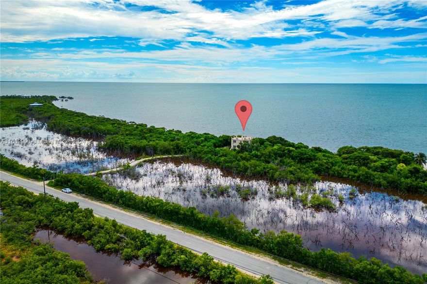 Discover one of the rare properties offering over 300 feet of stunning beach frontage in the beautiful Lower Keys. This CBS home boasts expansive balconies on every level and a rooftop deck, perfect for enjoying breathtaking, unobstructed water views. If you're seeking privacy and serene ocean vistas, this is the ideal retreat. Conveniently located near walking and biking trails, marinas, and top-notch restaurants, this home offers the perfect blend of tranquility and convenience. Whether you're looking for a primary residence or a vacation getaway, bring your imagination and finish this home to create your dream oasis!