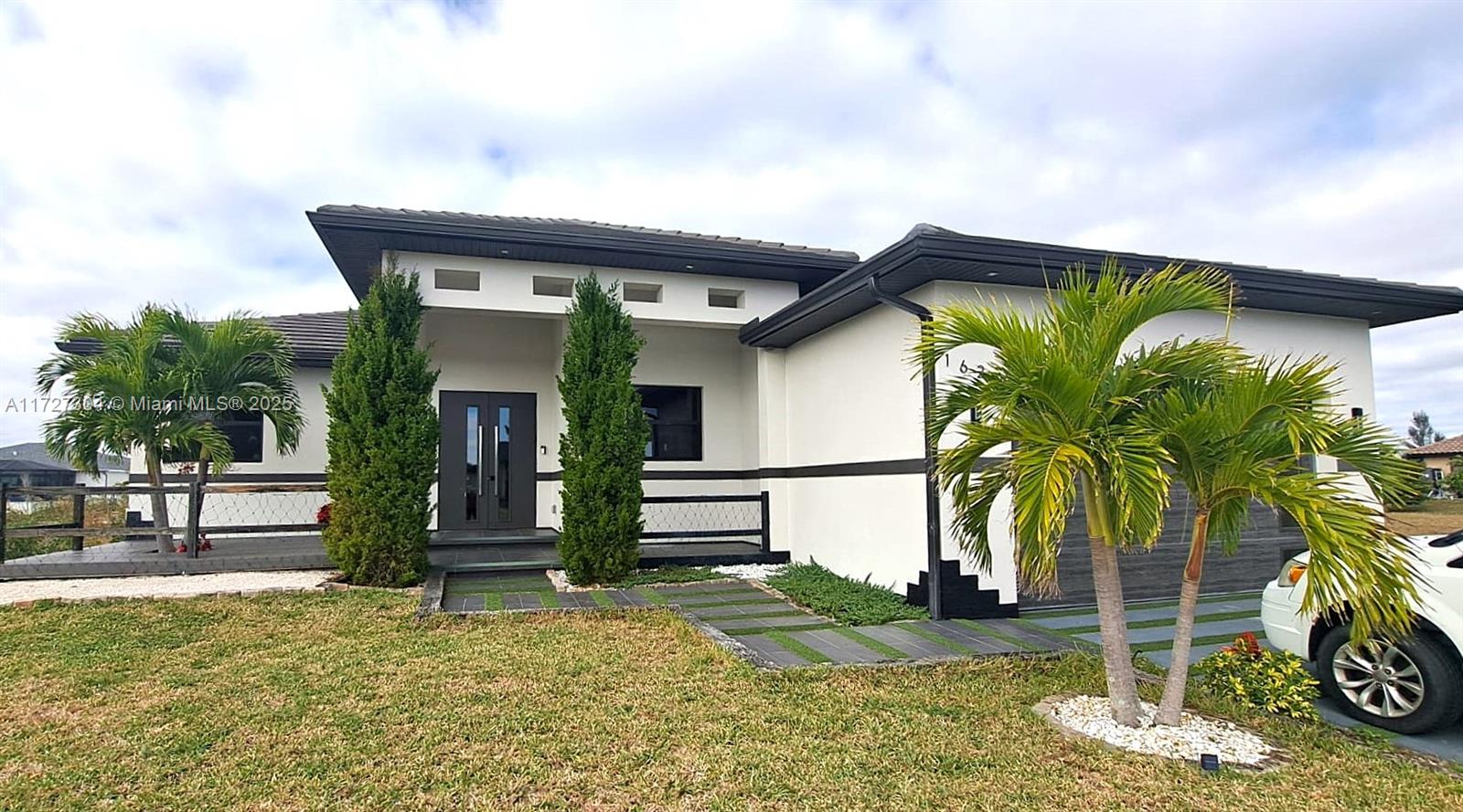 CUSTOM NEW HOME WITH 3 MASTER BEDROOMS, GULF ACCESS, lots of upgrades, high quality materials, elegant modern design, smart technology, high elevation, a unique gem. Either for a large family that loves entertaining, fishing and sailing, or as a touristic rental, this is the opportunity to buy a property rarely available, for an incredible price. The house is elevated to double the high required by City and insurance. Storm resistant, insulated metal door, with 4 glass panes. The garage has a window to the side of the house, plenty of natural light. Ceilings heights vary from 10 to 12 feet. Digital tempered glass light switches and outlets. European style L shaped kitchen. Island with 4 to 6 seats, stainless steel sink, dishwasher and waterproof cabinets. Bathroom has jet technology.