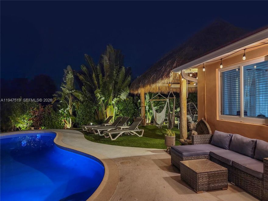 Experience resort-style living year-round in this exceptional canal-front home with impeccable landscaping. Thoughtfully updated and professionally designed, this residence features newer saltwater concrete heated pool, private floating dock, and a charming very private expansive backyard with oversized Tiki—perfect for relaxing or entertaining. Enjoy peace of mind with a newer roof, hurricane-impact windows and doors installed in 2022, and a new AC system. EV charger installed and the whole house is pre-wired for the generator. Meticulously maintained house, freshly painted interiors complement the home’s modern, coastal aesthetic. Ideally located in a highly desirable area, close to shopping, dining, entertainment, and major conveniences. This is waterfront living at its finest—where comfort, style, and location come together seamlessly.