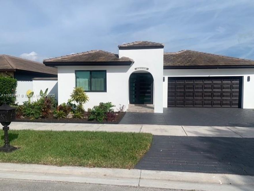 Beautiful one-story home with 3 spacious bedrooms and 3 full bathrooms. Features a 2020 roof and no HOA! Enjoy a free-form pool and fully paved backyard, perfect for entertaining. Filled with natural light through abundant windows. Includes a 2-car garage, new washer/dryer, and a stunning 2021 remodeled kitchen with large peninsula and stainless steel appliances. Tankless water heater, accordion shutters for hurricane protection, and multiple living areas—foyer, family, dining, and living rooms. Master bathroom offers an oversized shower for ultimate comfort. Move-in ready! Great location close to good schools ,shopping, banks and much more ! No flood zone