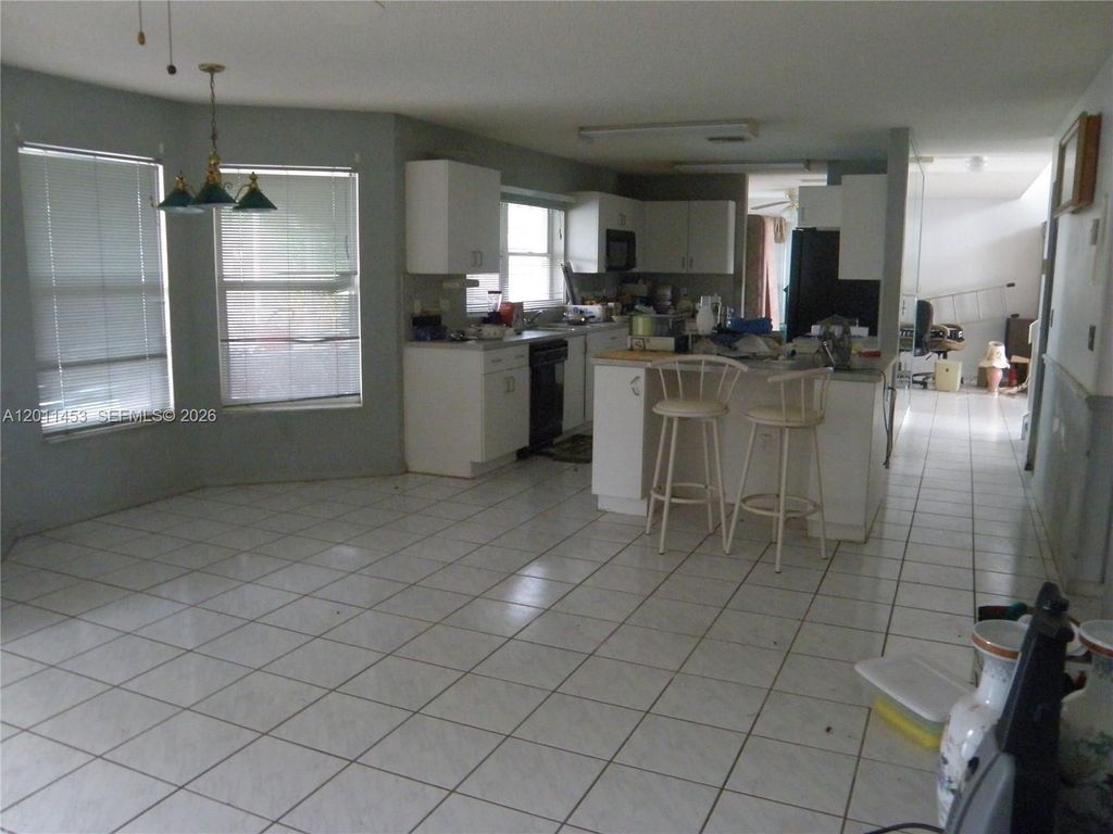 Photo of 722 NW 177th Ave, Pembroke Pines, FL 33029 (MLS # A12011453)
