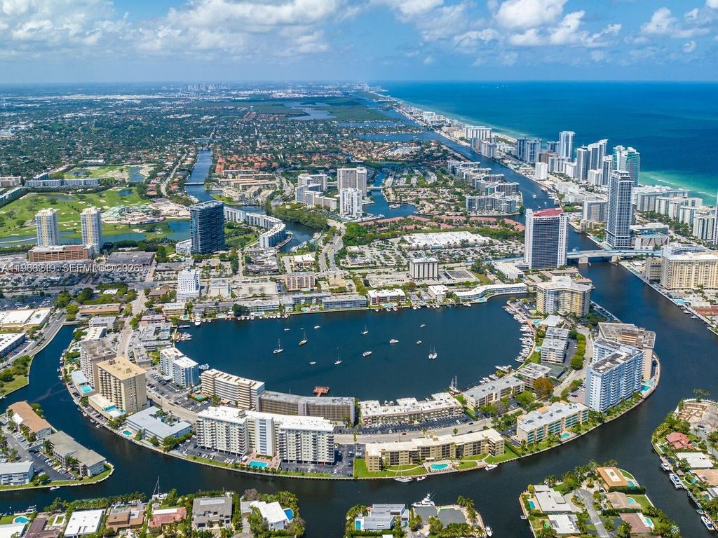 Photo of 400 Golden Isles Dr #10, Hallandale Beach, FL 33009 (MLS # A11988219)