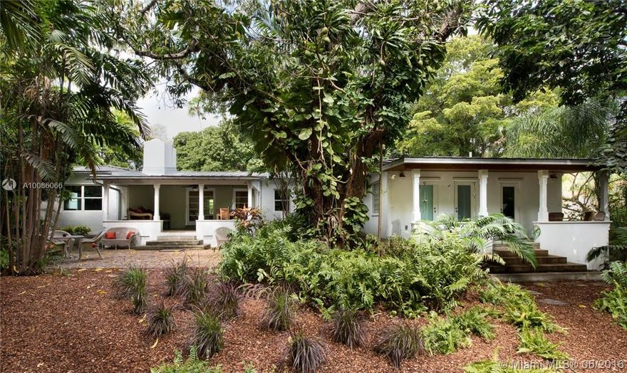 Escape to your own Fairchild Tropical Garden in the N. Grove; 20,000sf property is located on top of the coral ridge, offering one of the highest elevations in Miami and a coral rock wall affords extra privacy. Main House features original wood floors, open kitchen w/granite and SS appliances, formal D/R and L/R w/art deco fireplace and expansive porch w/Cuban tiles.  1/1 Guest House boasts vaulted ceilings, French doors, L/R, D/R, kitchen and porch. Close to downtown, beaches, marinas and best schools.