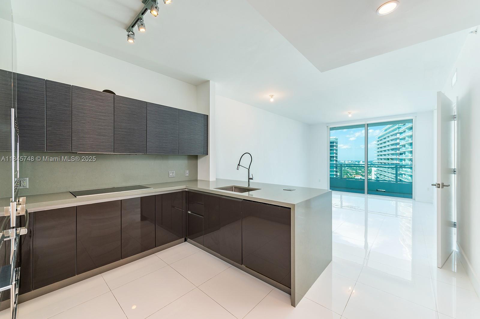 1 bedroom 1 bathroom With Den the heart of Brickell with views of Coral Gables. The Bond's British glamour can be seen through the beautiful details of the building including Terry O'neill's famous photography of British stars, British inspired library and living room with a pool table, and even a full gym that overlooks South Miami ave. Enjoy sunny Sunday afternoons barbecuing in Bond's barbecue grills or relax by the lap pool.