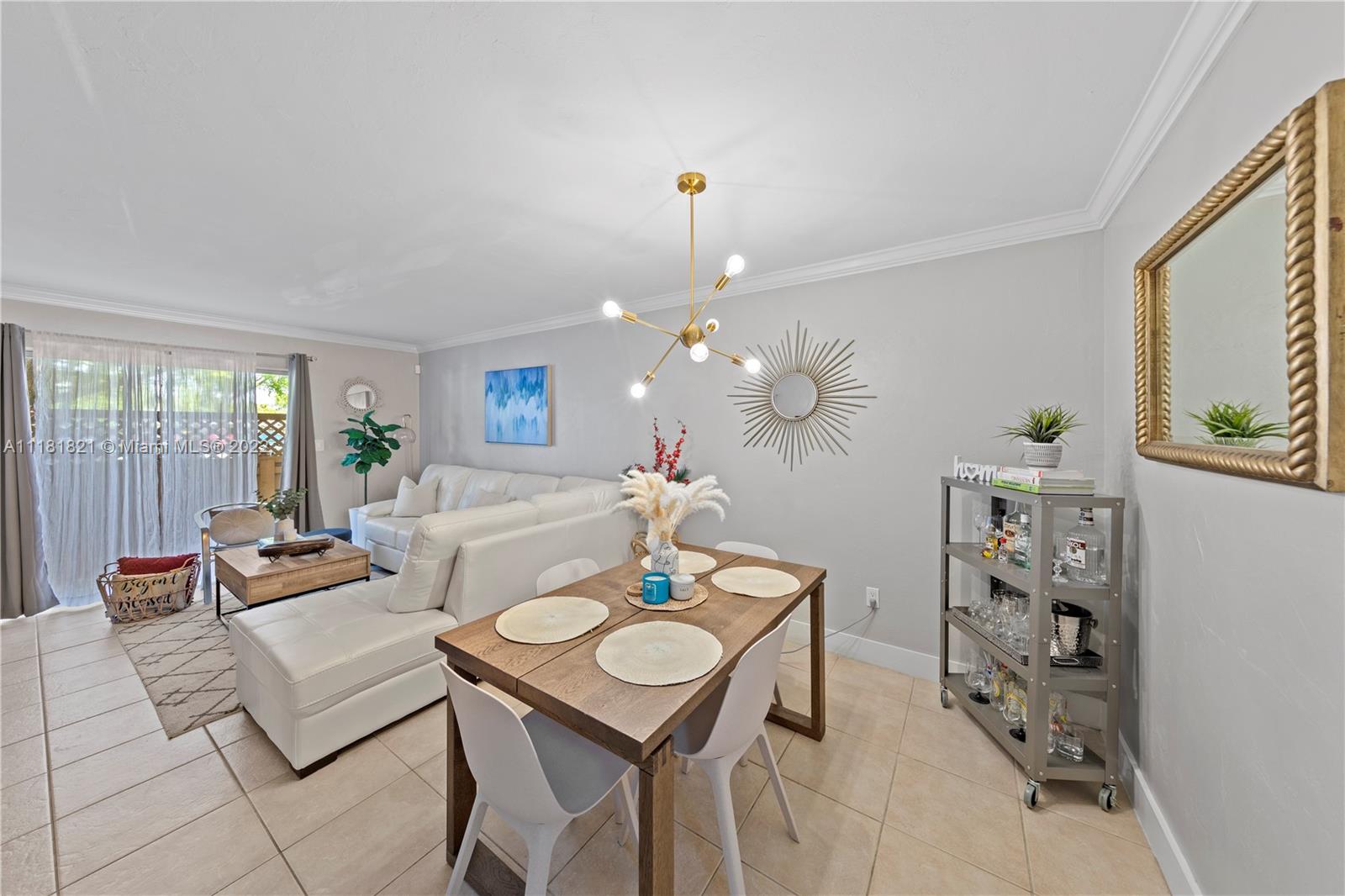 CASH ONLY: Beautiful first floor 2/2 condo in the heart of Kendall with patio! This home features a tastefully remodeled kitchen with quartz countertops, white shaker cabinets and stainless steel appliances. Also included are updated bathrooms, easy-to-maintain tiled flooring throughout and in-unit washer and dryer. This unit has 2 assigned parking spaces and pool/playground in this gated community. Centrally located near major highways, hospitals, schools, restaurants, and shops. INVESTORS: the assn is rental-friendly and 2BRs are currently going for +$2000/mo. Don't miss out!